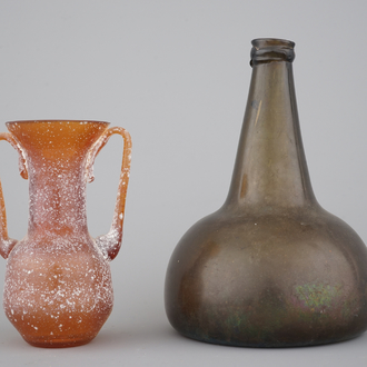 A green glass wine bottle, 18th C. and an orange glass amphora after the Antique