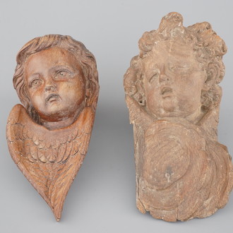 Two carved wood putto heads, 18th C.
