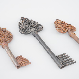A set of 3 very large cast iron keys, shop signs, 19/20th C.