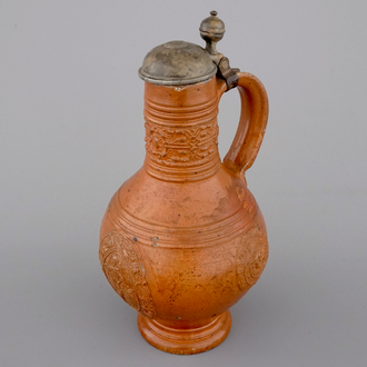 A tall Raeren stoneware jug with the Roman god Mercury, dated 1618