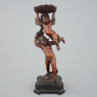 A carved boxwood vase stand with putti, Venice,late 17th C., circle of Andrea Brustolon