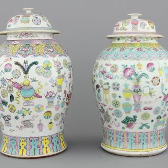 Two Chinese porcelain famille rose jars and covers with scholar's objects, 19th C.