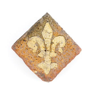 A medieval tile with a Fleur-de-Lys, probably Franco-Flemish, 14th C.