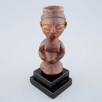 An African carved wood fetish figure on stand, Luba, Congo