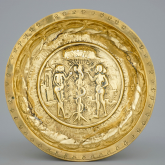 A Nuremberg brass alms bowl depicting Adam and Eve, 15/16th C.
