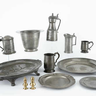 A large collection of pewter, incl. jugs and dishes, and two brass shakers, 17/19th C.