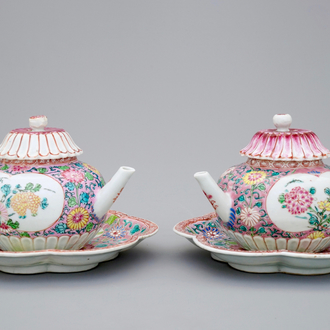 A pair of Chinese famille rose teapots on stand, Yongzheng/Qianlong, 18th C.