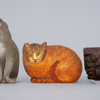 An 18th C. carved wood cherub's head and two painted wood cats, 19/20th C.