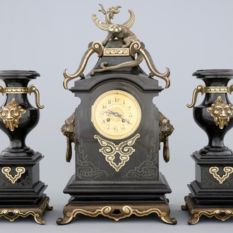 A three-piece gilt bronze and black marble chinoiserie garniture, 19th C.