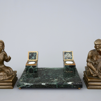 An art deco green marble inkwell and a pair of figurative book ends, 20th C.