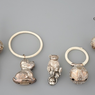 Two rattles and three biting rings in silver and ivory, 18/19th C.