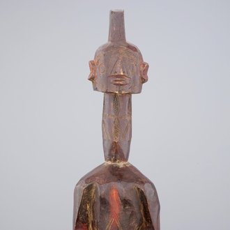 An African carved wood figure, 3rd quarter 20th C.