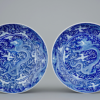 A pair of Chinese blue and white dragon dishes, Kangxi mark and of the period