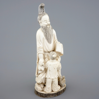 A Chinese carved ivory group of a sage with a child, 19th C.