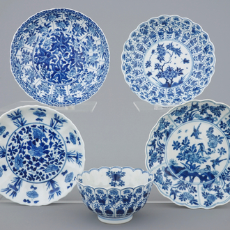 Three Chinese blue and white plates and a lotus shaped cup and saucer, Kangxi