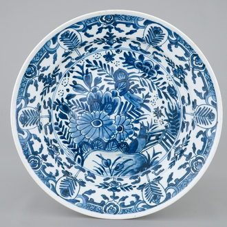 A rare Chinese blue and white plate after a Dutch Delft example, Qianlong, 18th C.