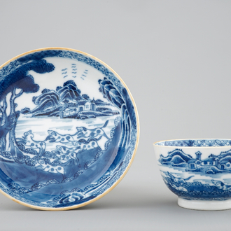 A Chinese blue and white cup and saucer with dogs, Qianlong, 18th C.