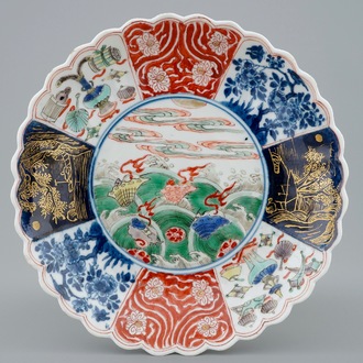A lobed Chinese famille verte plate with shells among waves, Kangxi