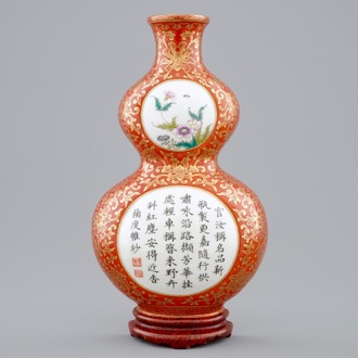 A Chinese coral-ground gilt-decorated famille-rose wall vase, Qianlong mark, 19/20th C.