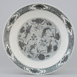 A Chinese Swatow dish with a blue-grey design of fish, Ming Dynasty, 16/17th C.