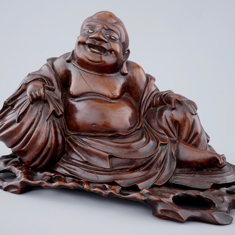 A large Chinese carved wood figure of Buddha on stand, 19th C.