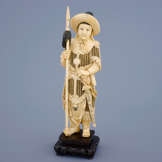 A Chinese carved ivory figure of a female warrior on a wooden base, late 19th C.