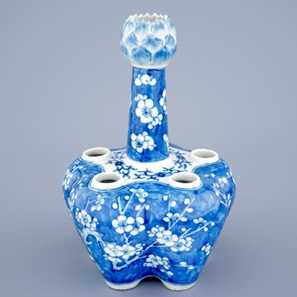 A Chinese blue and white tulip vase with prunus design, 19th C.