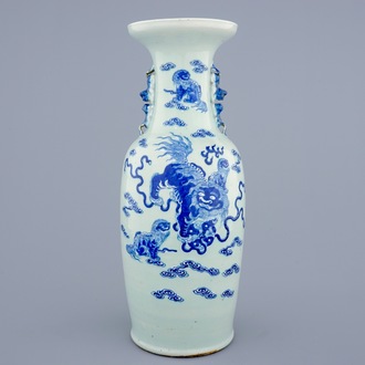 A Chinese blue and white on celadon ground porcelain vase with foo dogs, 19th C.