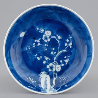 A Chinese blue and white saucer dish with prunus branch, Yongzheng mark and of the period