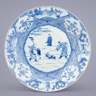 A massive blue and white Chinese charger with a punishment scene, Yongzheng/Qianlong