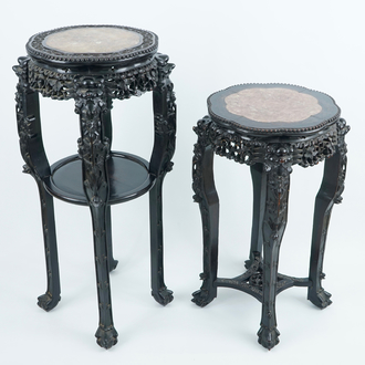 Two tall round Chinese carved wood stands with marble top, 19/20th C.