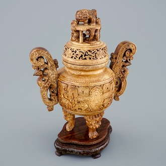 A Chinese carved ivory tripod censer on wooden base, 19th C.