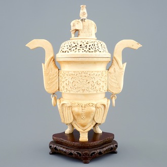 A Chinese carved ivory censer on a wooden base, ca. 1900