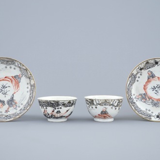 A pair of Chinese grisaille and gilt cups and saucers, Qianlong