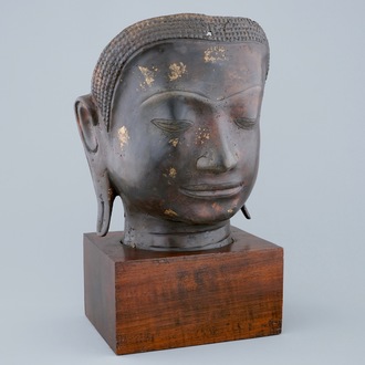 A gold-splashed bronze head of Buddha, South-East Asia, 19/20th C.