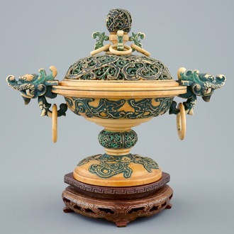 A Chinese polychrome ivory censer with cover on wooden base, 19th C.