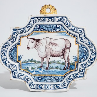 A polychrome Dutch Delft plaque with a cow, 18th C.