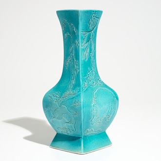 A Chinese turquoise glazed fanghu vase with applied slip design of animals, 19/20th C.