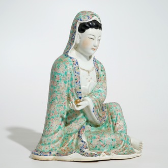 A Chinese famille rose model of a seated Guanyin, 19th C.