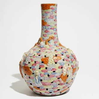 A Chinese famille rose reticulated bottle vase with figures, 19th C.