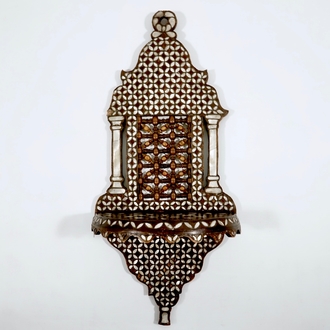 A Syrian wall bracket of wood inlaid with mother of pearl, 19/20th C.