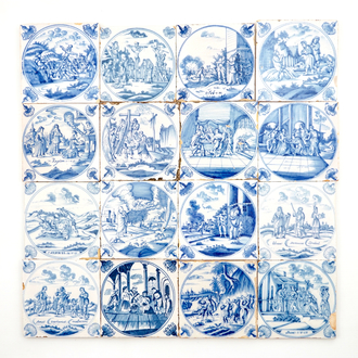 A set of 16 Dutch Delft blue and white biblical tiles with carnation corners, 18th C.
