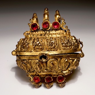 A gilt bronze amulet box with coloured glass inlay, India, 18th C.