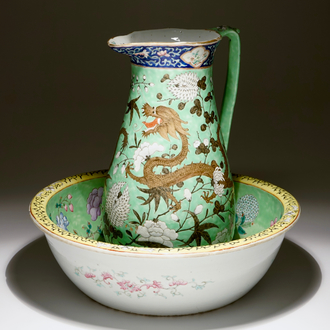 A large Chinese water jug and basin with black dragons on a lime green ground, 19th C.