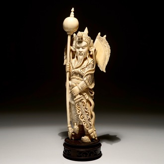 A Chinese carved ivory figure of a warrior on a wooden base, late 19th C.