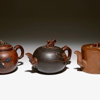 A set of three Chinese Yixing teapots, 20th C.