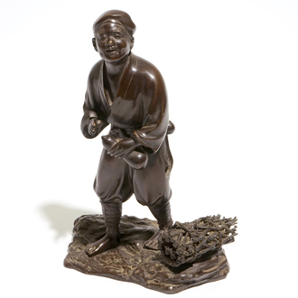 A Japanse bronze figure of a man with a double gourd, Meiji