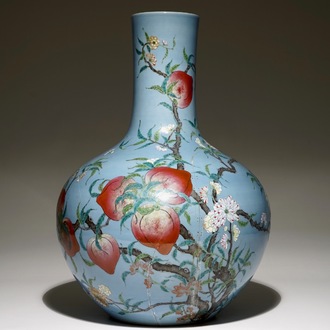 A Chinese famille rose blue ground tianqiuping “Nine peaches” vase, 19/20th C.