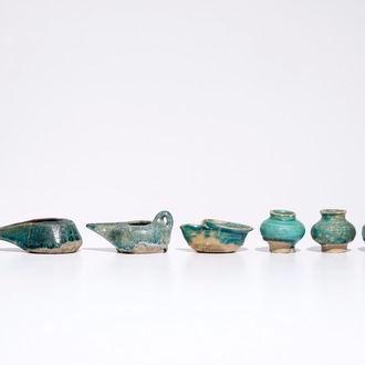 A collection of Islamic turquoise glazed oil lamps, jars and vessels, a.o. Raqqa, 13th C. and later