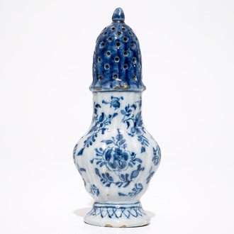 A Dutch Delft blue and white floral caster, 18th C.